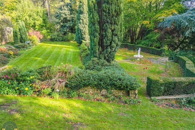 A variety of mature trees, shrubs and bushes add colour and screening to the gardens.