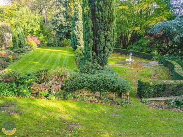 A variety of mature trees, shrubs and bushes add colour and screening to the gardens.