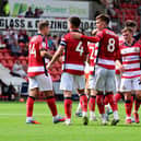 Rovers' players celebrate Owen Bailey's equaliser. Picture: Andrew Roe.