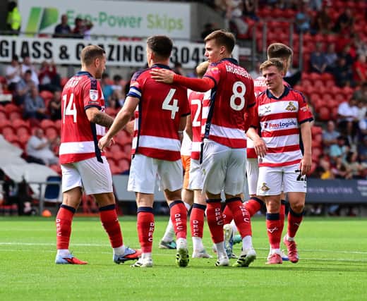 Rovers' players celebrate Owen Bailey's equaliser. Picture: Andrew Roe.