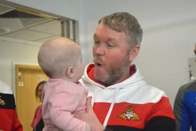 Grant McCann meets a young fan at Doncaster children's hospital.