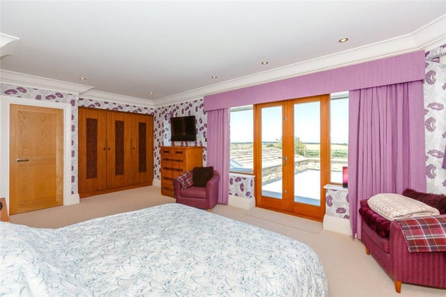 There are six bedrooms throughout the property, the principal suite features built-in wardrobes, matching bedside cabinets, and a large sun balcony offering glorious views over the countryside.