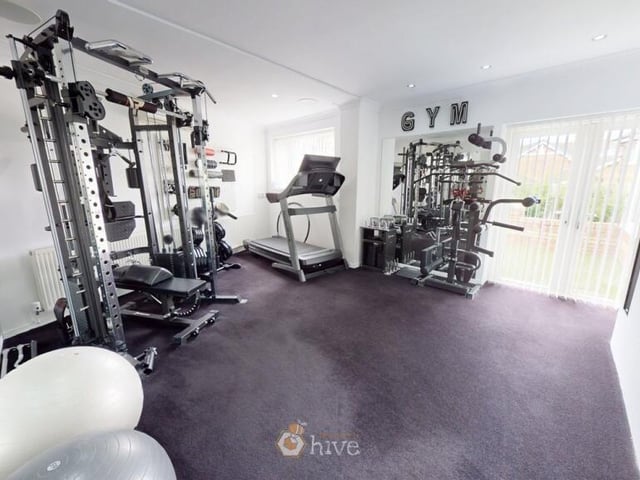 The spacious home gym is air conditioned.