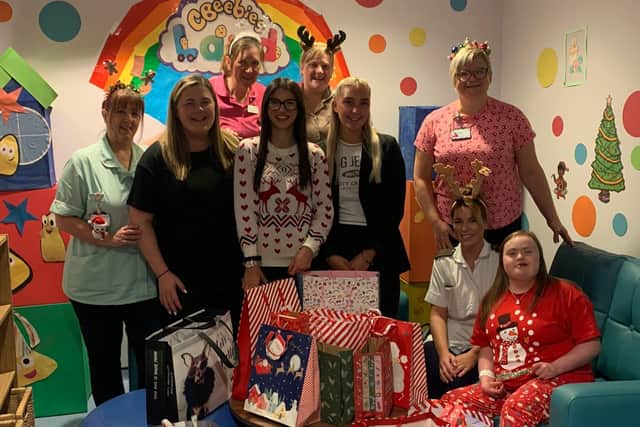 The team from William H Brown in Doncaster donate gifts to the Children’s Ward at DRI.