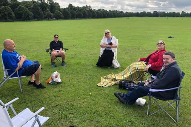 Members of the CDS Well Being group meeting up in a park with social distancing in place.