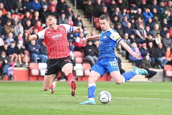 Tommy Rowe in action against Cheltenham. Picture: Howard Roe/AHPIX LTD