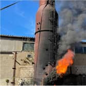 The chimney fire erupts at the maggot breeding farm.