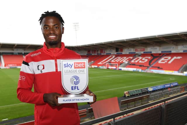 Madger Gomes with his EFL Player of the Month award for September. Photo: Howard Roe/AHPIX LTD