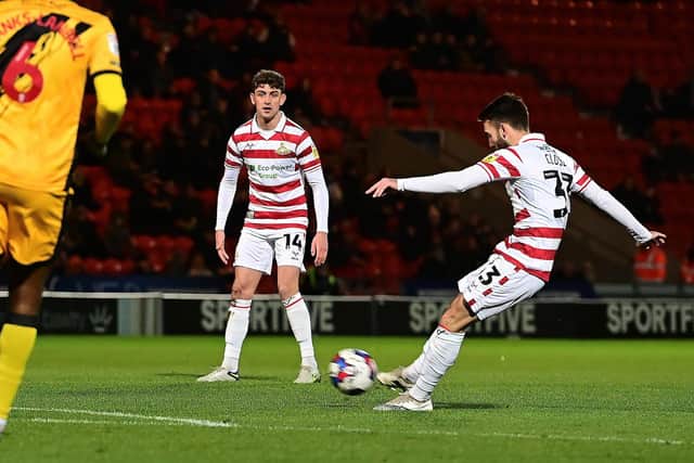 Doncaster's Ben Close fires in the second goal.
