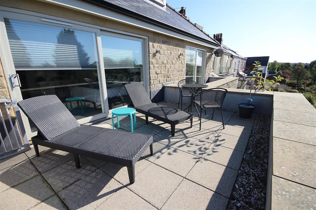 The outside, south-facing balcony is accessed from the master bedroom - it's laid with paving and provides space for sun loungers and an outdoor table and chairs.