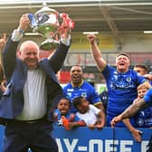 Dons chief executive Carl Hall celebrates promotion.
