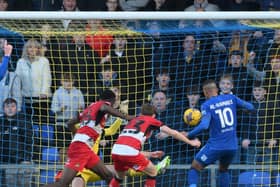 Ali Al Hamadi opens the scoring for AFC Wimbledon against Doncaster Rovers.