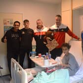 Club Doncaster (Rovers, Belles and Rugby League) giving a gift to a young patient on the Children’s Ward at Doncaster Royal Infirmary (DRI).