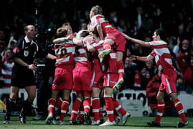 Doncaster Rovers celebrate their second goal during the Carling Cup match against Aston Villa at Belle Vue on November 29, 2005. (Photo by Shaun Botterill/Getty Images)