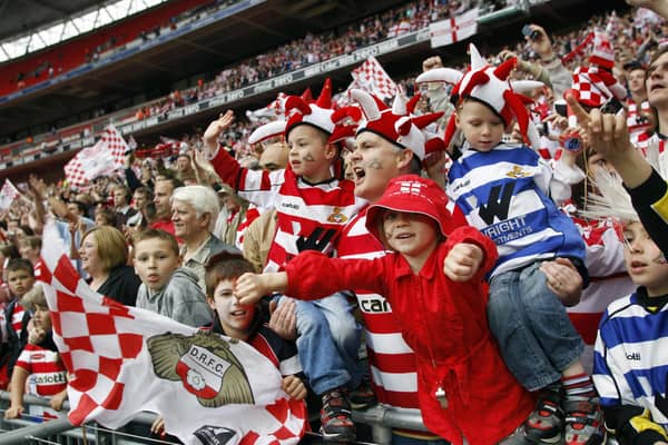 Doncaster Rovers supporters celebrate after beating Leeds United during the Football League One play-off final on May 25, 2008.