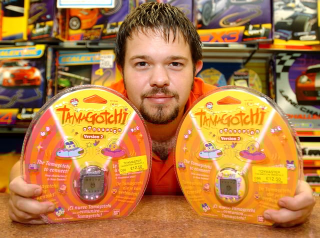 Tom Evans Assistant Manager of Toymaster in Meadowhall, with a Tamagotchi which was predicted to be a Christmas best seller