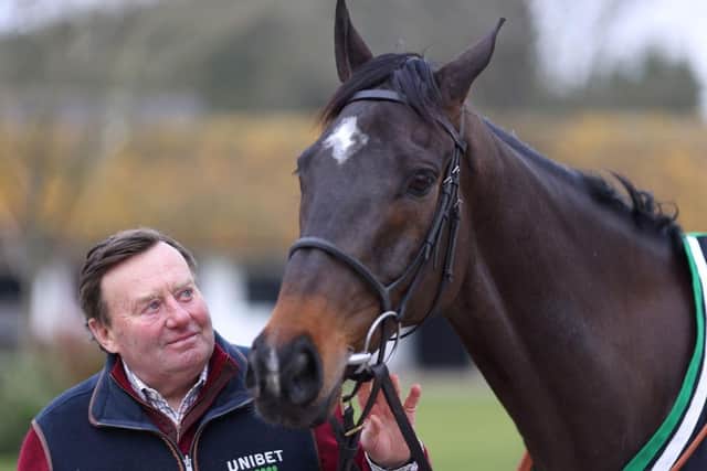 Trainer Nicky Henderson with Shishkin at Seven Barrows Stables. Photo: Richard Heathcote/Getty Images