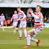 James Maxwell reacts after his goalbound effort is blocked.
