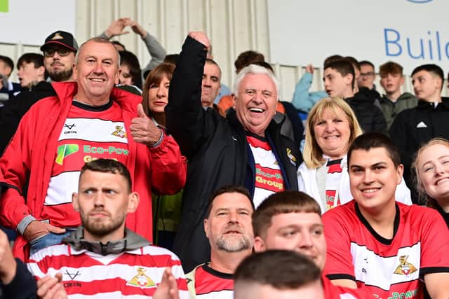 Doncaster Rovers' former owner John Ryan pictured with his sister on the opening day of the season.