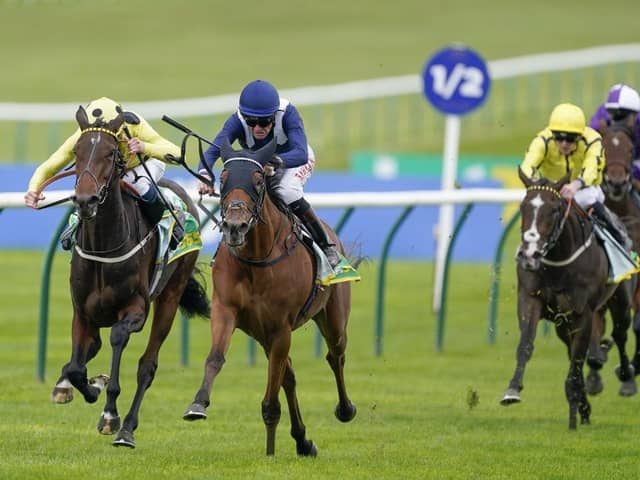 Robert Havlin rides Commissioning (blue) to victory in the bet365 Fillies' Mile at Newmarket on Friday. Photo: Alan Crowhurst/Getty Images