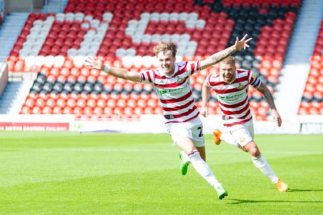 Doncaster's Kyle Hurst celebrates his equaliser in the first half.