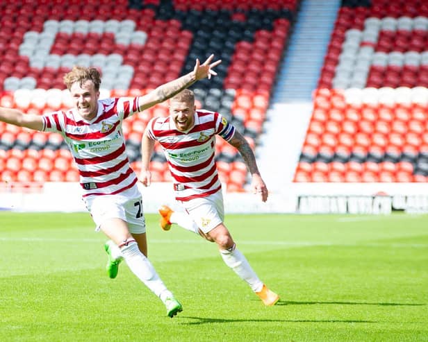 Doncaster's Kyle Hurst celebrates his equaliser in the first half.