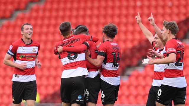 The Rovers players celebrate Ben Close's second goal.