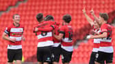 The Rovers players celebrate Ben Close's second goal.