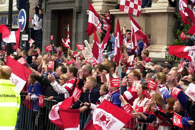 Fans cheer their team as they arrive at the Mansion House for the Civic reception.