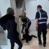 Footage shows the teenage girl being knocked to the floor and then dragged through broken glass by a security guard inside the Frenchgate centre.