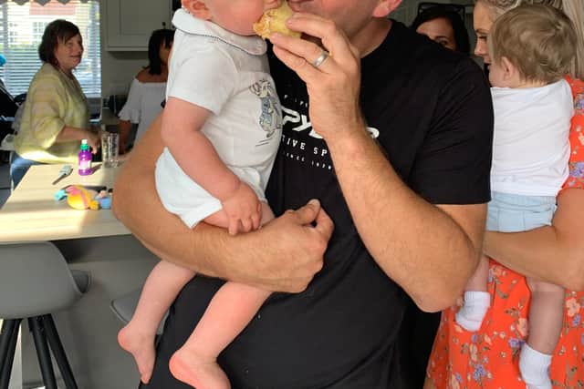 Little George Clarking at his first birthday party with his dad Steve Clarking, 35.