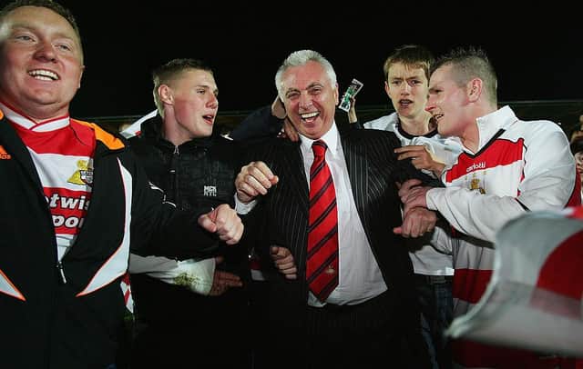 Former chairman John Ryan is mobbed by fans following Rovers' win against Southend in the 2008 League One play-offs. Photo by Matthew Lewis/Getty Images