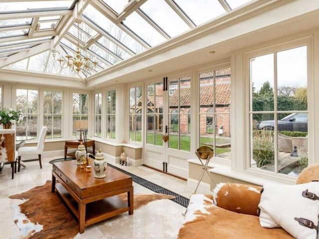 The large and versatile orangery, that has doors out to the gardens.