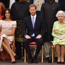 Meghan Markle pictured with husband Prince Harry and the Queen