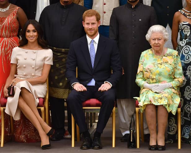 Meghan Markle pictured with husband Prince Harry and the Queen