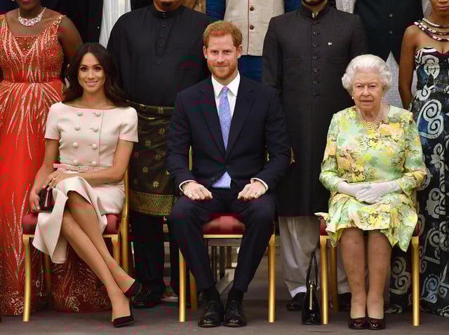 Meghan Markle pictured with husband Prince Harry and the Queen
