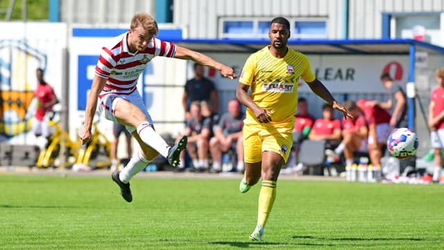 We're going for 4-4-1-1, given who's available. That would also give McSheffrey the option to call upon an in-form striker from his bench. Both Josh Andrews and George Miller have been among the goals in pre-season.