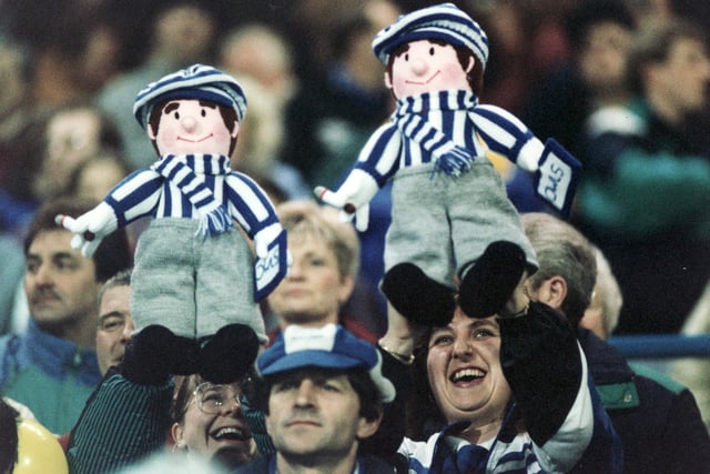 Two Wednesday fans cheer their team on against Derby County in the FA Cup sixth round at Hillsborough in March 1993.