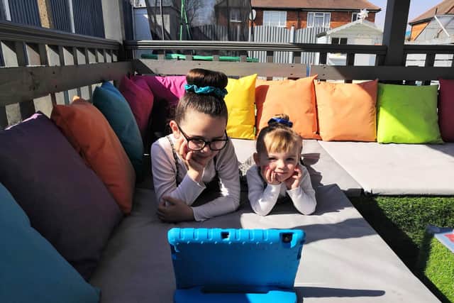 Ava-Lilli Chapman, 8, Evie-Rose Chadburn, 3 watching Mr Roberts story time.