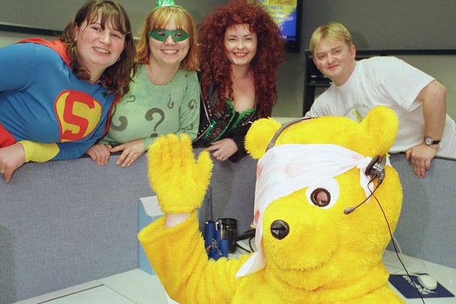BT Doncaster Call Centre staff who were among 282 volunteer staff, most of them in fancy dress, and manned the phones to raise cash for Children in Need in 1997. Many of them worked on the line till 3.00am on Saturday.  Pudsey Bear Mal Blake with staff, BT Sales supervisor Leigh Machen (Superwoman), Tracey Barnes ( Riddler), Sonja Newton (Poison Ivy) and Paul Rushby as himself.
