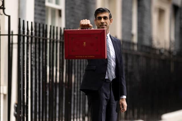 Chancellor of the Exchequer Rishi Sunak holds the budget box ahead of delivering his Autumn Budget and Spending Review to Parliament