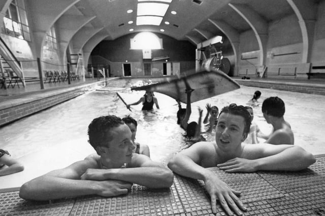 Karl Peacock and Ian Gardener take a rest as youngsters enjoy their last day at Derby Street baths in August 1993.