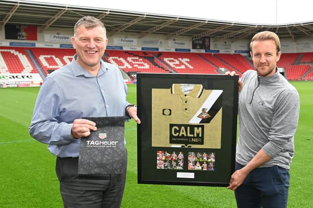 James Coppinger receives tokens of appreciation for his playing career from Doncaster Rovers CEO Gavin Baldwin