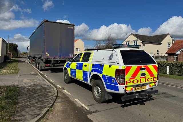 Police clampdown on HGVs using limited access village road.