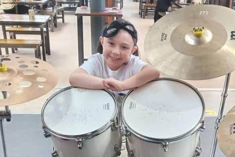 She is already working towards her grade eight on the drums.