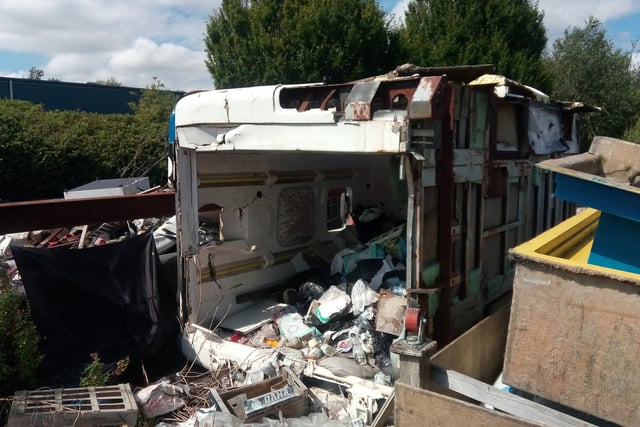 A storage cabin has been burst wide open and more rubbish dumped around it