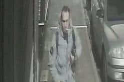 A CCTV image of the man police would like to speak to in connection with a theft.
