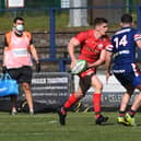 Saracens' Owen Farrell takes on Doncaster's Kyle Evans. Pictures: Jonathan Gawthorpe