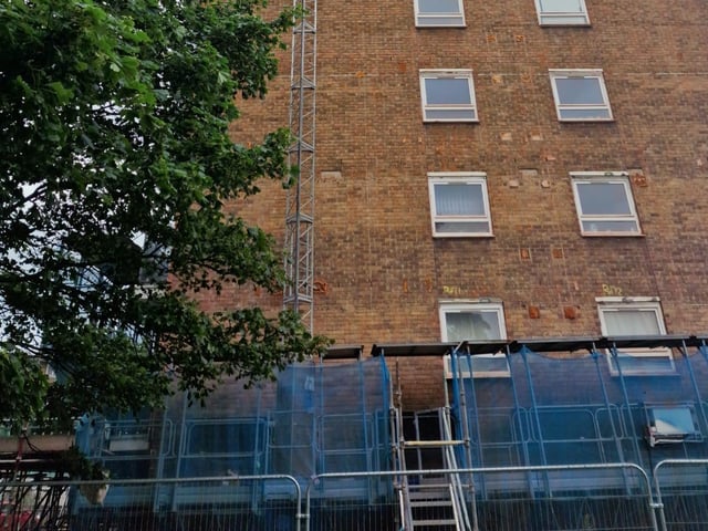 The flats Murka was stuck on the side of, showing a platform that was used in the rescue, the blue structure at the bottom of the photo
