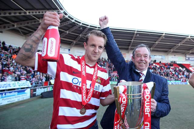 James Coppinger and Brian Flynn celebrate winning the League One title